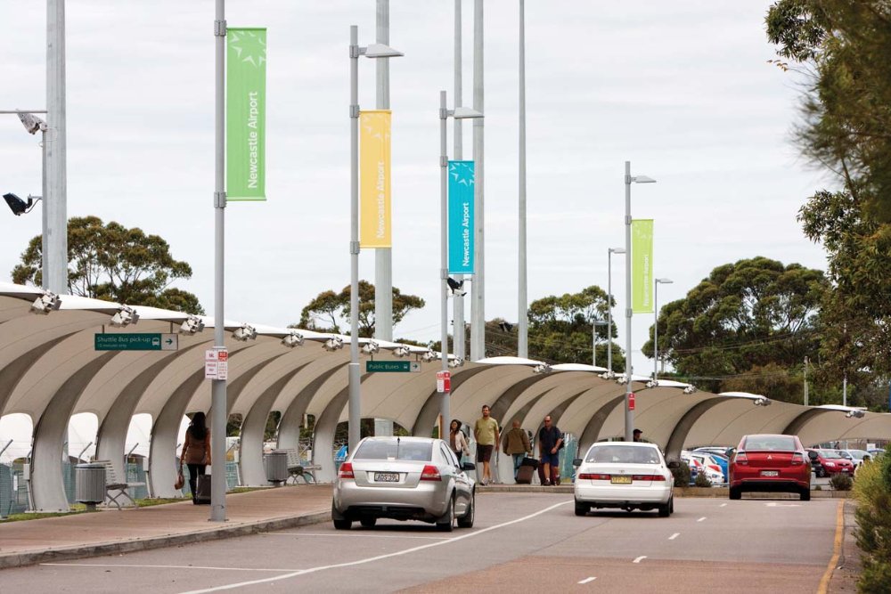 Cars driving through the airport pick up and drop off areas