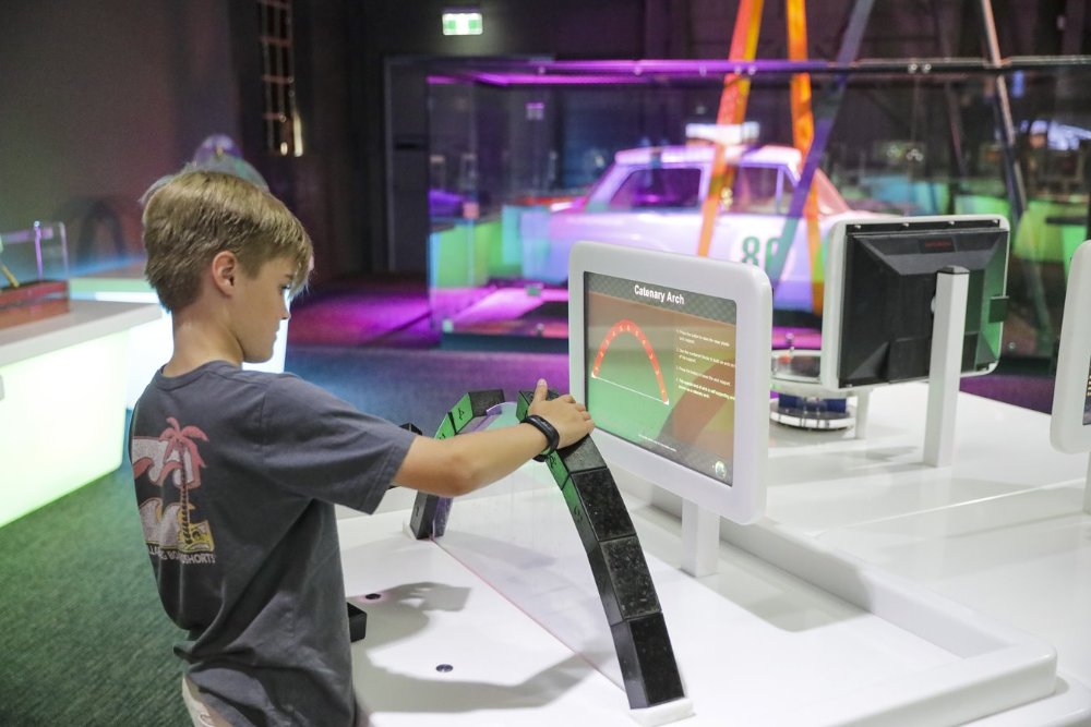 Kid playing with technology at newcastle museum