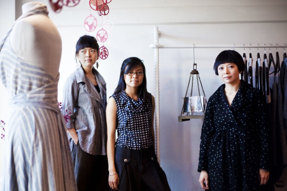 Three woman standing in their retail store High Tea with Mrs Woo