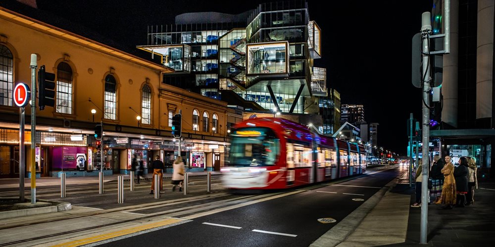 The lightrail moving on Hunter Street at night