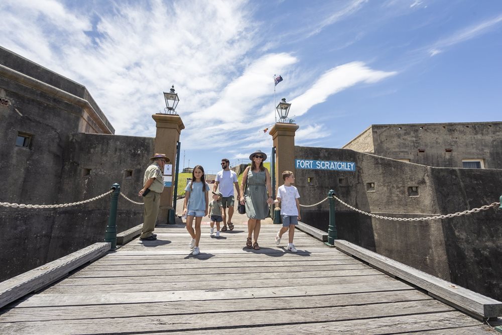 A family walking on a bridge at Fort Scratchley