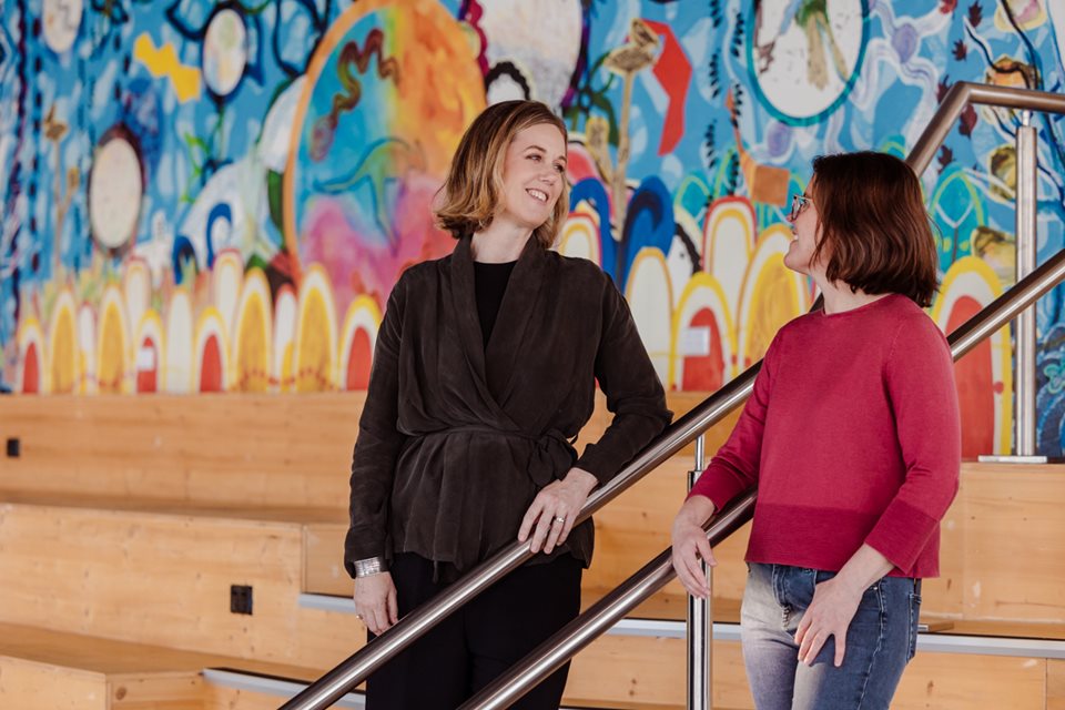 Two women talking at the Landing Pad