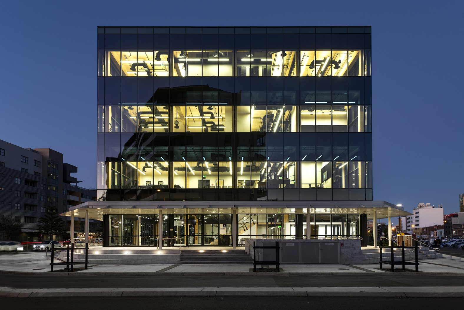 The outside of University of Newcastle's Q Building at dusk