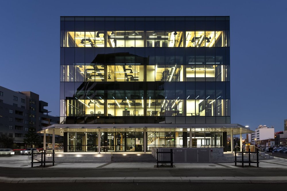 The outside of University of Newcastle's Q Building at dusk 