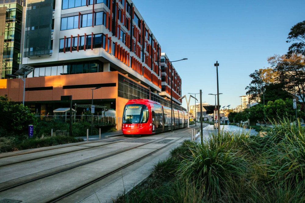 Tram stopping at a station in Newcastle West