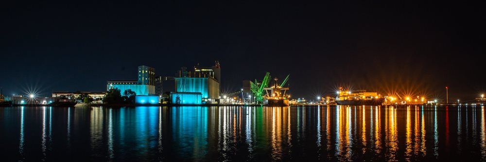 Newcastle Port at nighttime with colourful reflections over water