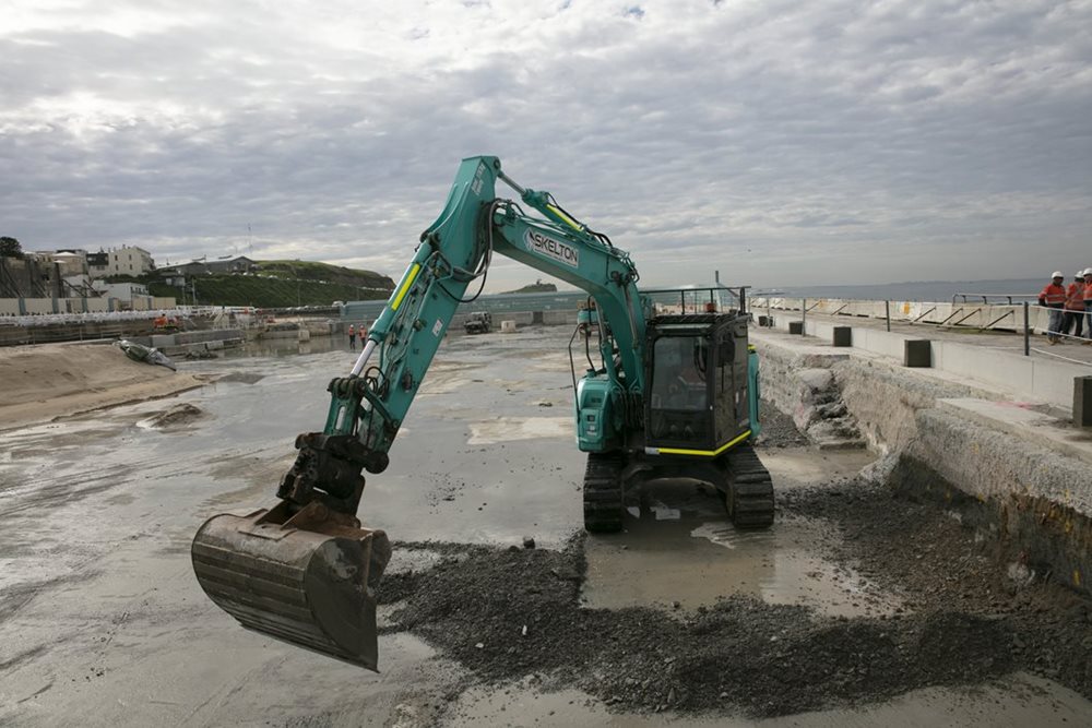 Digger at the construction site of Newcastle Ocean Baths