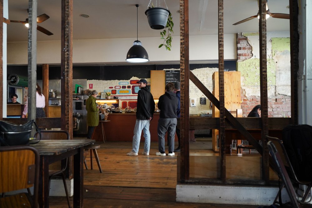 People lining up to order coffee in a cafe in Hamilton