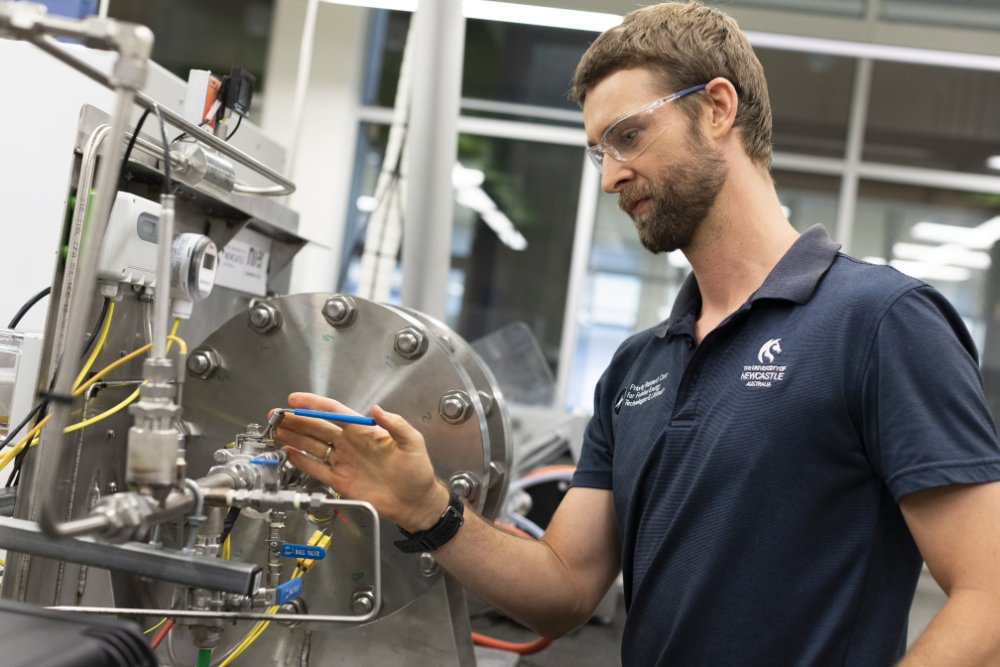 A man works on a small piece of machinery