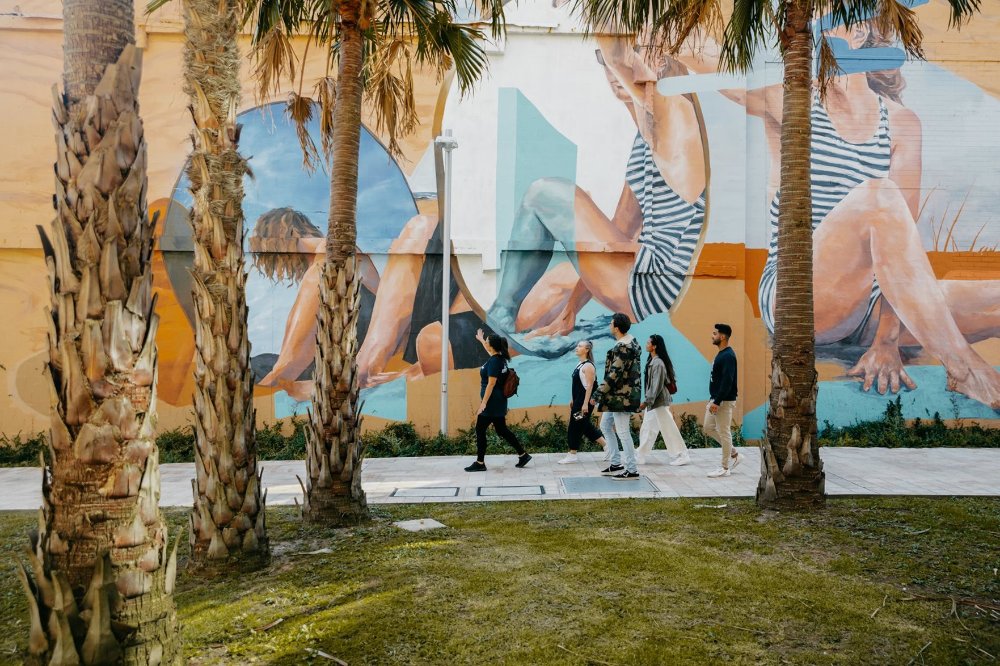 A group on a walking tour of Newcastle street art