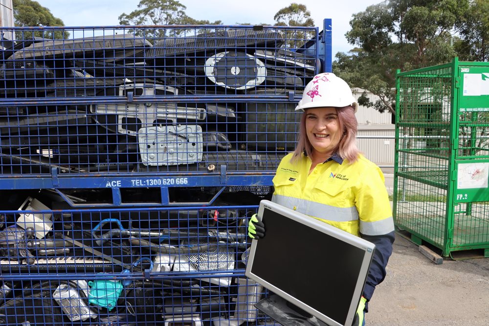 A council worker filtering through metals at Summerhill Waste Management Centre