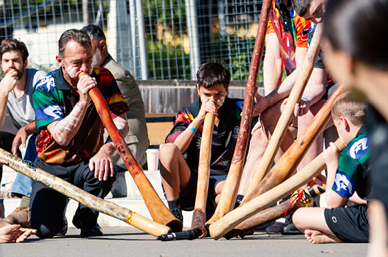 Men play the didgeridoo